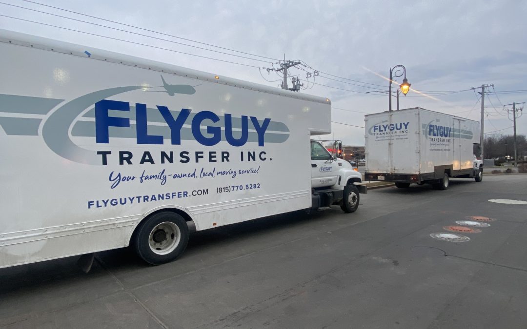 fly guy transfer trucks parked outside